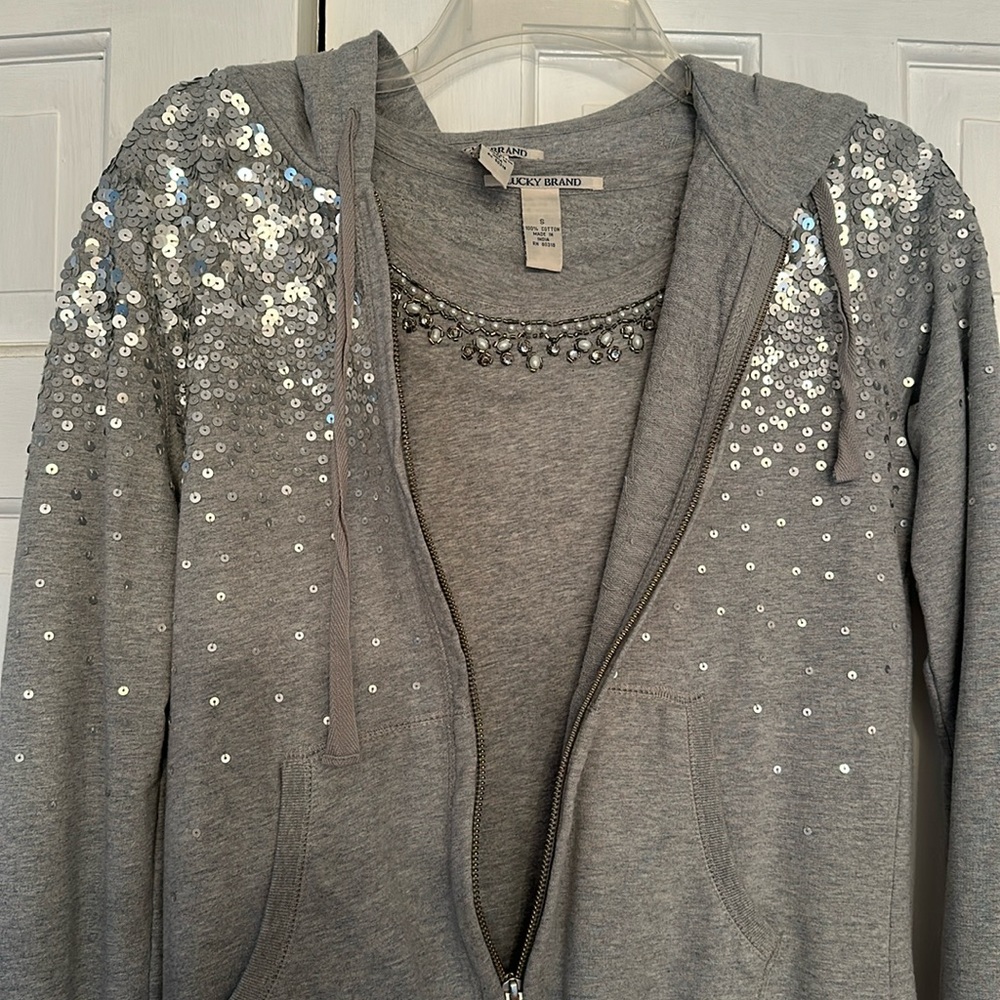 Embellished short sleeve top and silver sequined hoodie